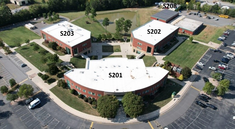 Aerial photograph of an RCCC campus plaza with buildings labeled SB and SBB.